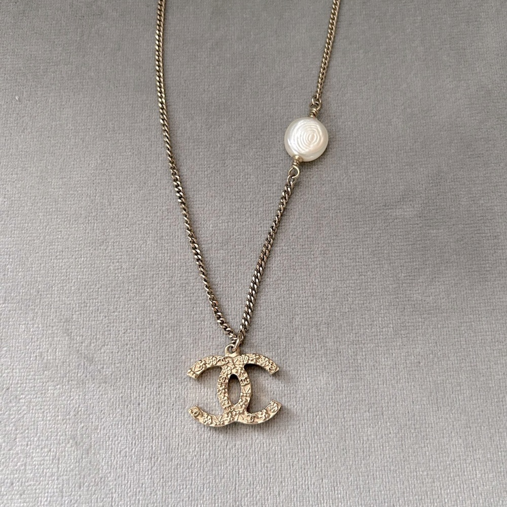 Authentic Chanel gold tone necklace with faux pearl